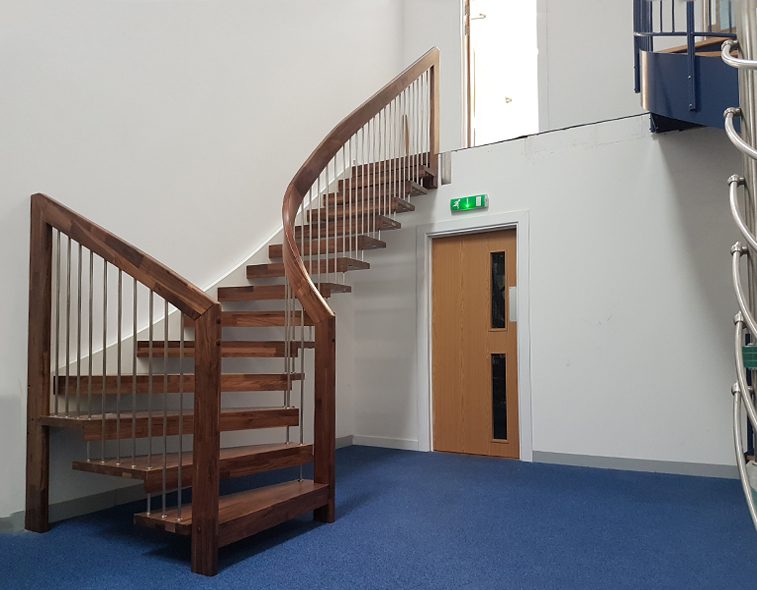 blue floor in a showroom with a floating dark timber stair