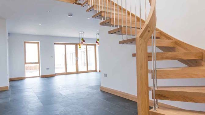 WF Floating Timber Staircase modern open oak floating stair in a hall with dark grey tiles