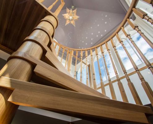 A view looking up at a Model 71 spiral staircase in Tilford