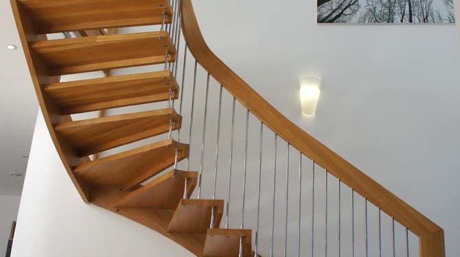 WF Floating Timber Staircase floating oak staircase against a white wall
