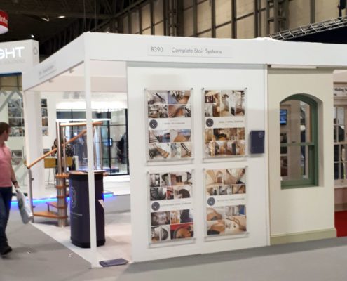 man walking past exhibition stand