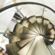 looking down on black wooden steps of a spiral staircase