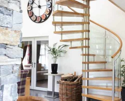 oak and stainless spiral stair on a polished tiled floor