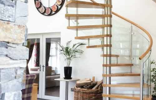 oak and stainless spiral stair on a polished tiled floor