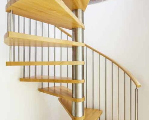 modern stainless and wood spiral stair with white wall