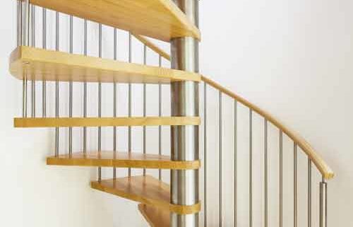 modern stainless and wood spiral stair with white wall