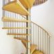 modern stainless and wood spiral stair with white wall