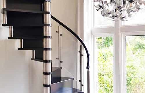 closed riser black spiral staircase with stainless steel column