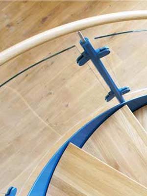 Curved-Glass-Panels on the side of a spiral staircase