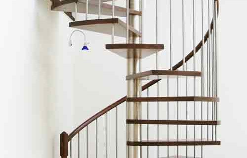 dark timber spiral staircase with stainless steel spindles