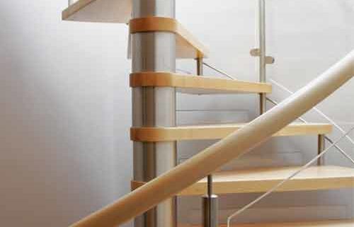 maple wood spiral staircase with curved panel balustrade