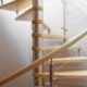 maple wood spiral staircase with curved panel balustrade