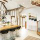 kitchen with breakfast bar with oak spiral staircase