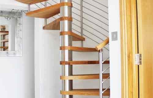 spiral staircase on grey floor with oak treads and open risers