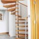 spiral staircase on grey floor with oak treads and open risers
