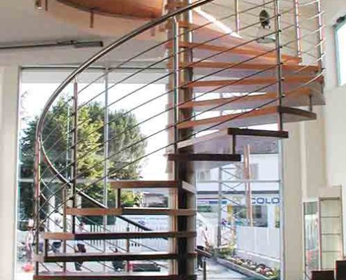 large spiral staircase in a showroom with tiled floor