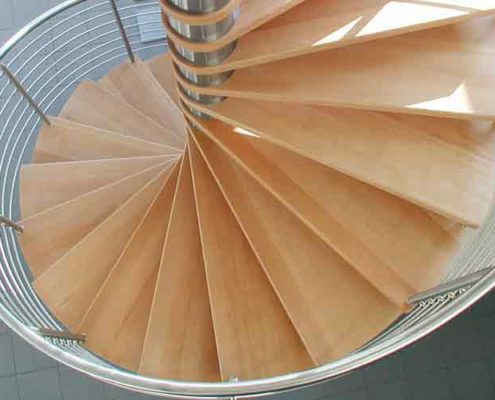 looking down on beech spiral staircase with stainless handrail
