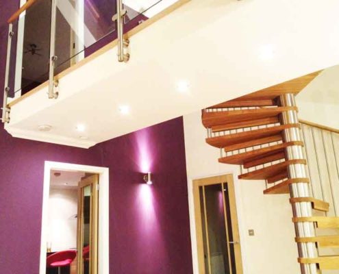 house with walkway with spiral staircase ascending