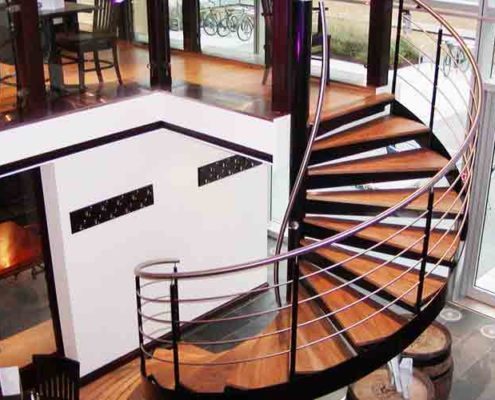 large black and wood spiral stair in a wine bar