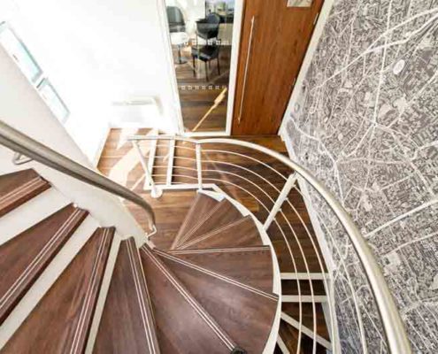 lower part of a timber spiral-Stair with stainless balustrade