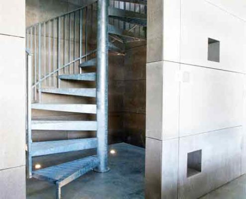 galvanised internal spiral stair in a concreate shaft