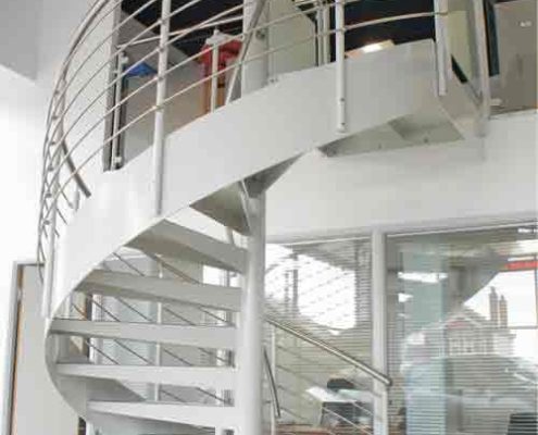 white steel spiral staircase with stringer
