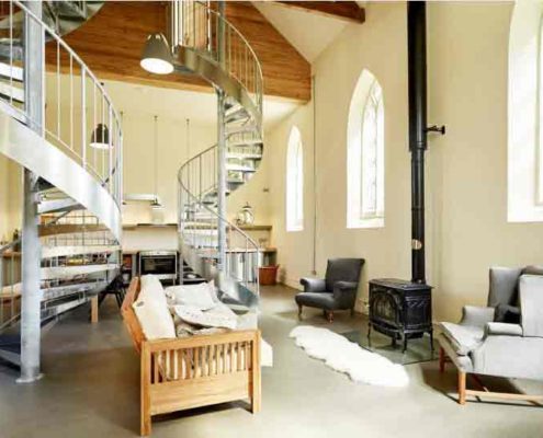two galvnaised steel spirals ascending within a church conversion