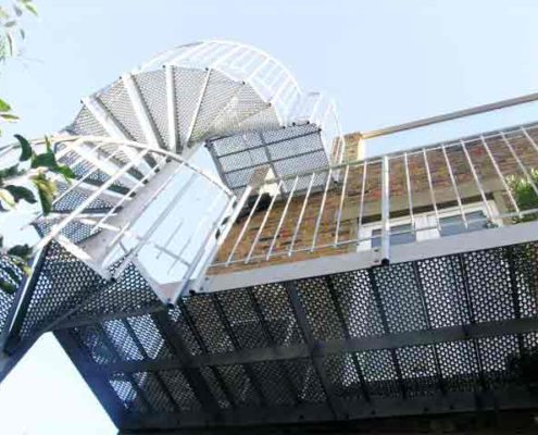 underside of spiral stair treads and balcony externally