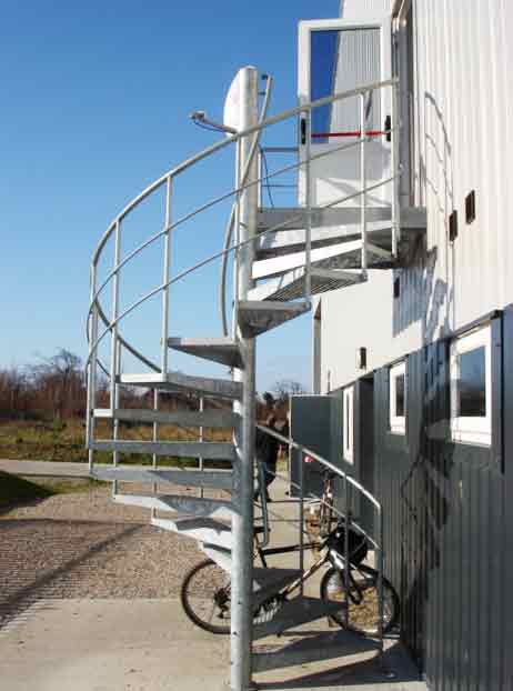 spiral stair fire escape outside a factory