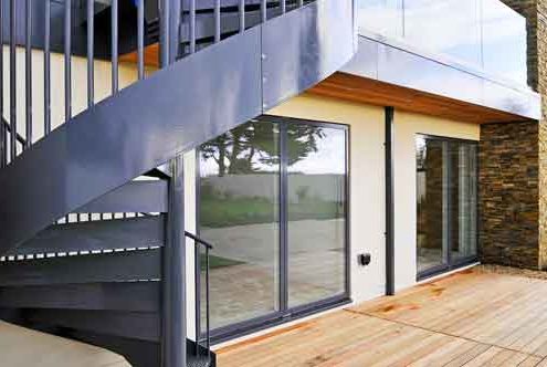 close up of external stringer of outdoor metal spiral staircase