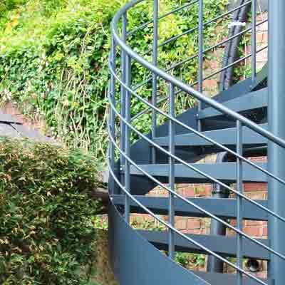 Horizontal-Steel-Rails steel horizontal balustrade rails on an outside spiral staircase
