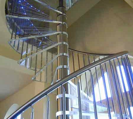 stainless steel spindles and handrail on a spiral stair with acrylic steps