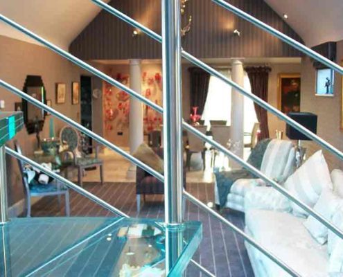 glass step on a spiral stair with stainless balustrade