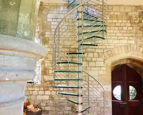 high spiral stair with glass steps in a church