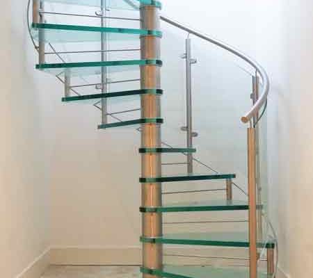 light and open glass spiral stair with stainless handrail