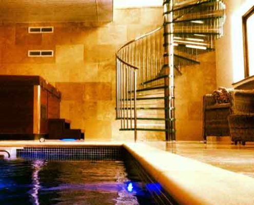 swimming pool with glass step spiral staircase