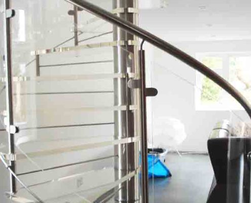 curved acrylic glass panels on modern spiral staircase