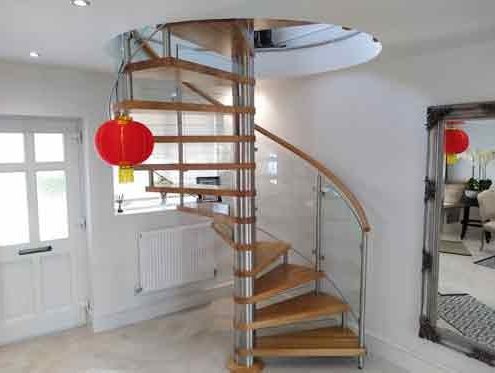 spiral stair in a hallway with a red light