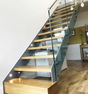 straight wood and steel stair with boxed in bottom step