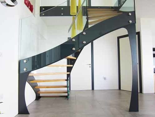 rear of black staircase with frameless glass balustrade