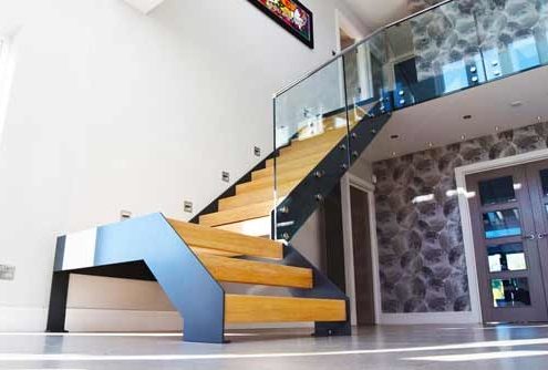 Bright hallway with a modern steel and wood staircase