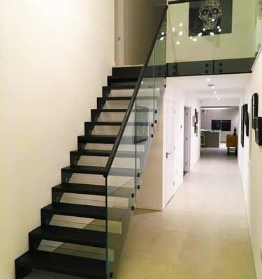 black open riser modern stair in a house