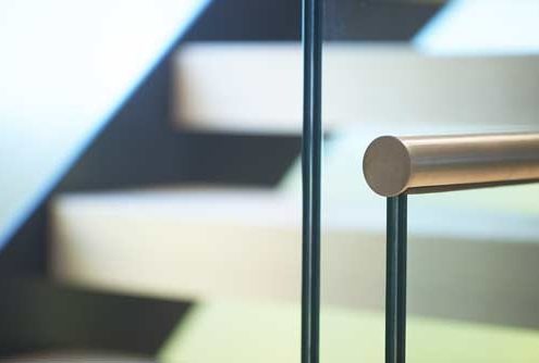 close up of laminated glass and stainless handrail
