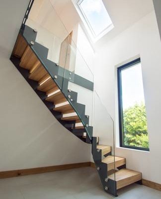 tiled floor with steel stringer staircase with glass panels