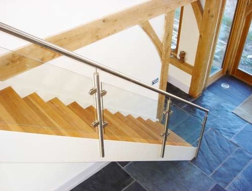 white steel staircase with glass balustrade