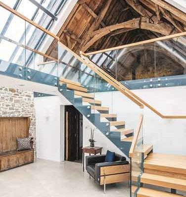 barn conversion with glass balustrade on a mezzanine level
