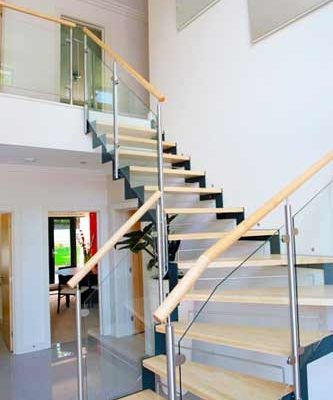 zig zag dark steel stringers with light wooden steps and open risers