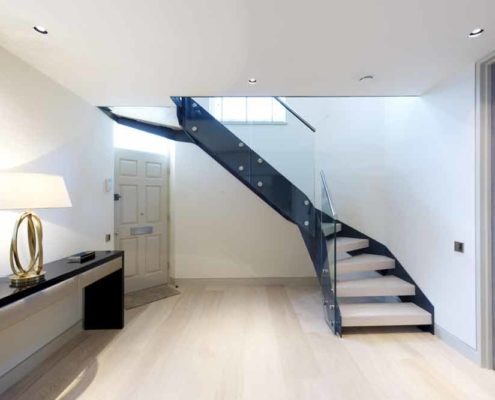 light timber floor with modern black steel and wood staircase