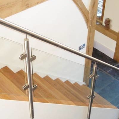 Posts-and-Glass Posts and Glass balustrade on a white steel stair