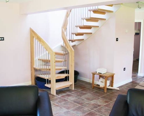 half turn with beech treads and handrail with tiled floor